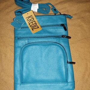 Blue Crossbody Bag with Textured Finish and Tassel